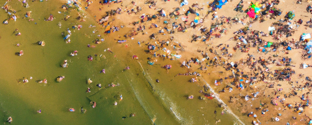 A drone photograph of a crowded beach, as rendered by DallE.